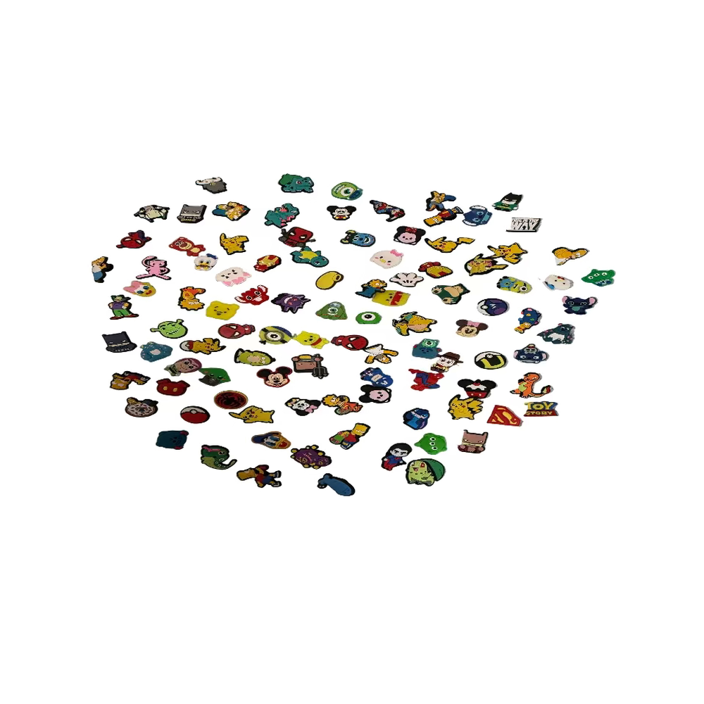 Collection of small colorful pins on a textured surface